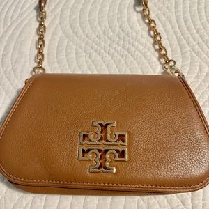 Tory Burch brown leather crossbody with gold logo.